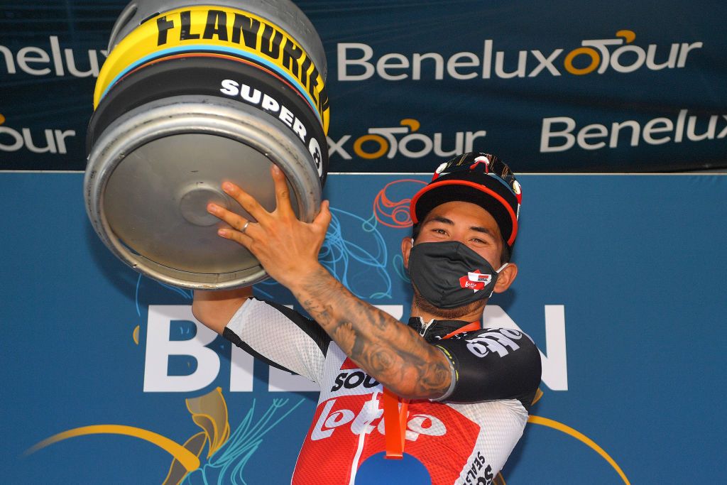 BILZEN BELGIUM SEPTEMBER 03 Caleb Ewan of Australia and Team Lotto Soudal celebrates winning the stage on the podium ceremony after the 17th Benelux Tour 2021 Stage 5 a 188km stage from Riemst to Bilzen BeneluxTour on September 03 2021 in Bilzen Belgium Photo by Luc ClaessenGetty Images