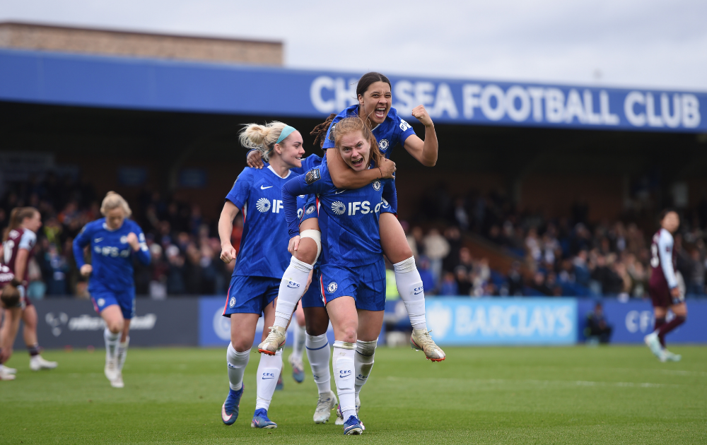 Sjoeke Nusken of Chelsea celebrates with teammate Sam Kerr after scoring her team's fourth goal during the Barclays Women's Super League match between Chelsea FC and Aston Villa at Kingsmeadow on March 29, 2026 in Kingston upon Thames, England. 