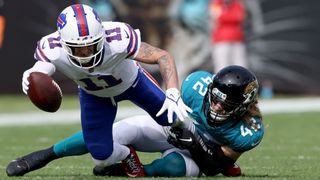 Andrew Wingard (R) makes a tackle ahead of the Jags vs Bills live stream
