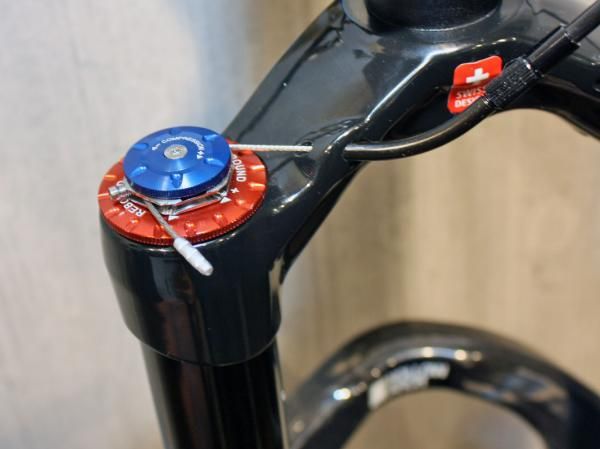 The XMC's bar-mounted remote allows riders to choose the best travel setting (open, closed, lowered) without relinquishing control.