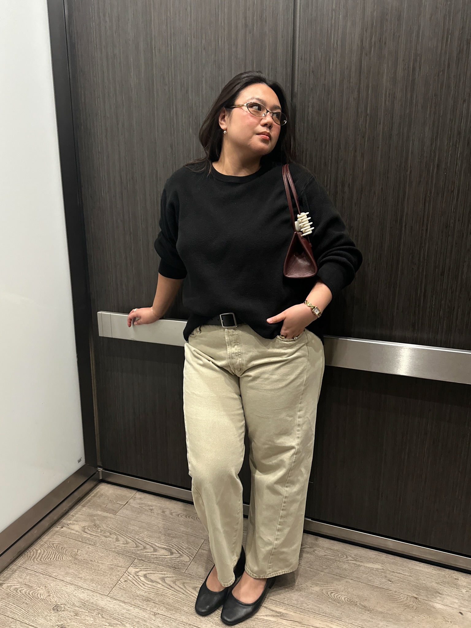 Marina in a black jumper and khaki jeans
