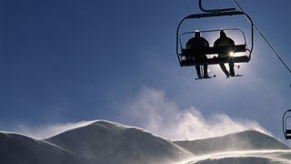 Skiers on chair lift at Breckenridge ski resort