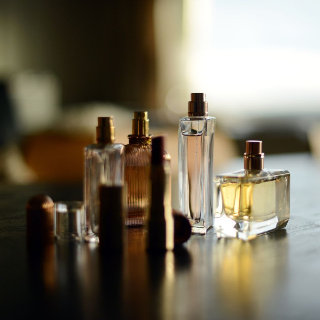best Zara perfumes - a pictue of scents lined up in the sun 