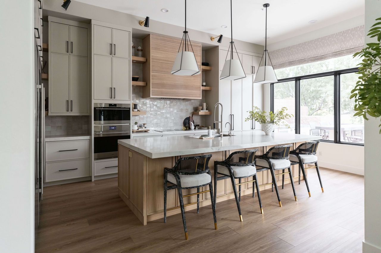 How to design an affordable kitchen that looks luxe; California kitchen with zellige backsplash, open shelving, and pendants over the kitchen island by Living with Lolo