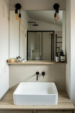 A bathroom with mirror lighting