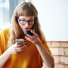 Eyewear, Glasses, Yellow, Orange, Blond, Photography, Sunglasses, Drinking, Brown hair, Street fashion, 