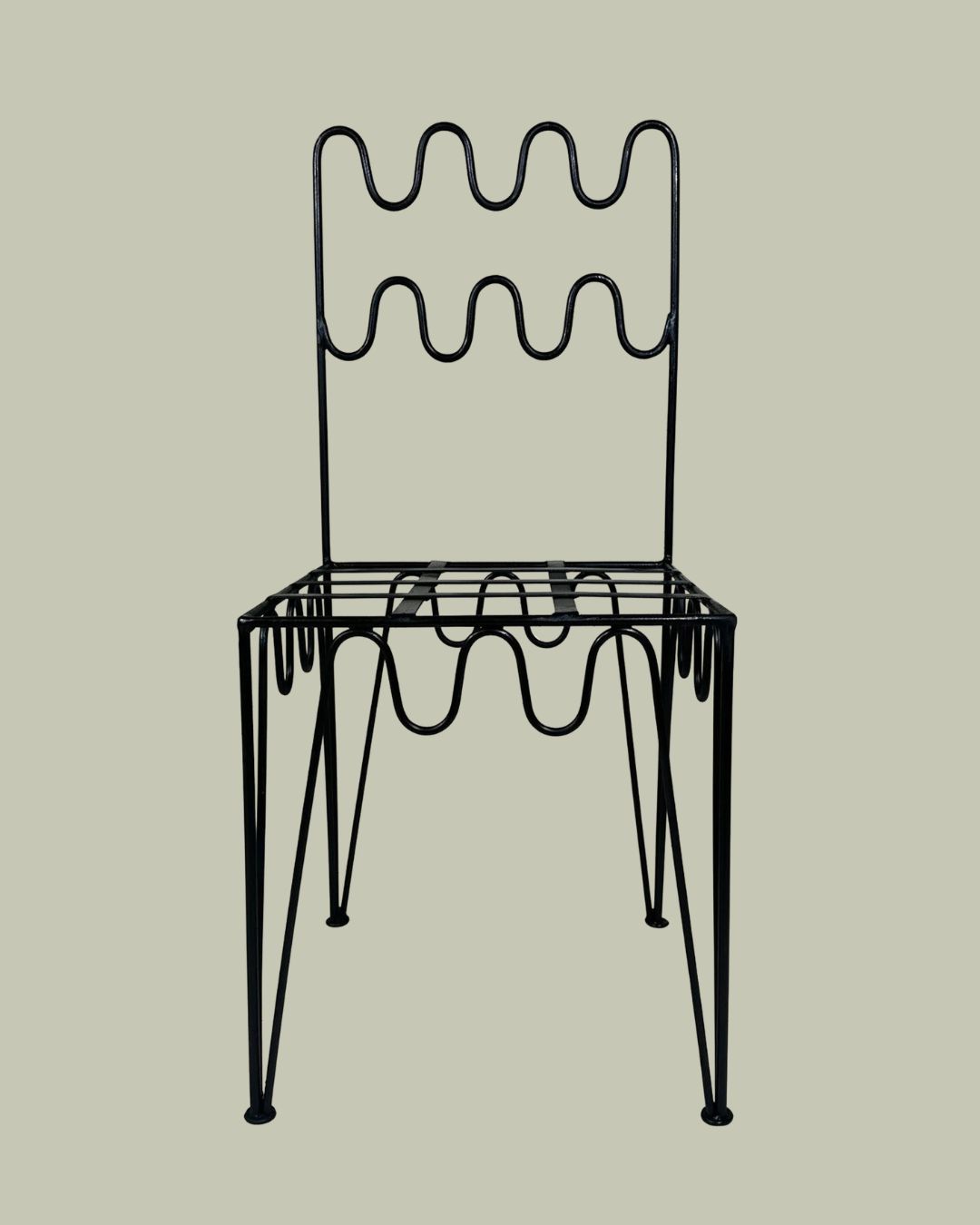 Moroccan Custom Stylish Iron Chair against pale green background.