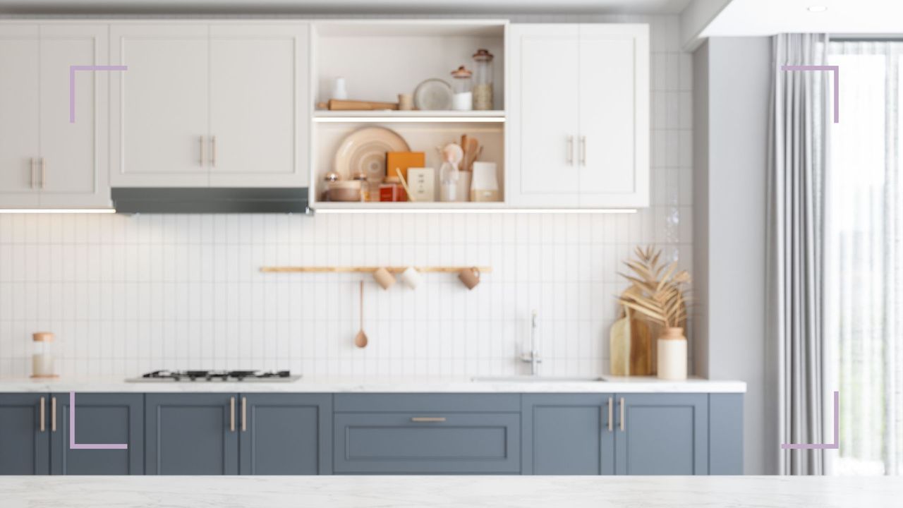 a clean kitchen with marble/quartz countertops with blue cupboards, and floating shelves