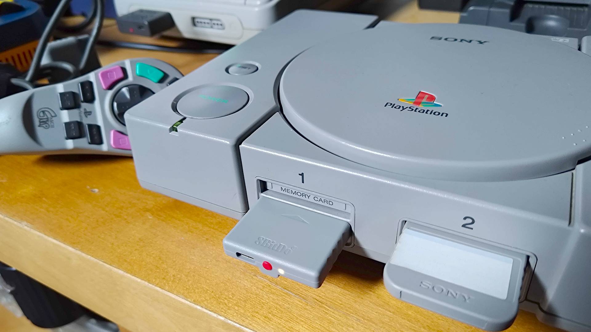 Close up of 8Bitdo Retro receiver for PS1 inserted into controller port 1.