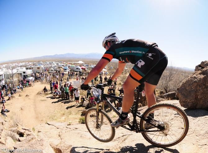 A rider gets some air while is cheered on by the spectators