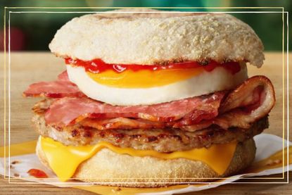 McDonald&#039;s new Mighty McMuffin - a bun filled with eggs, bacon, sausage, cheese and ketchup on a table