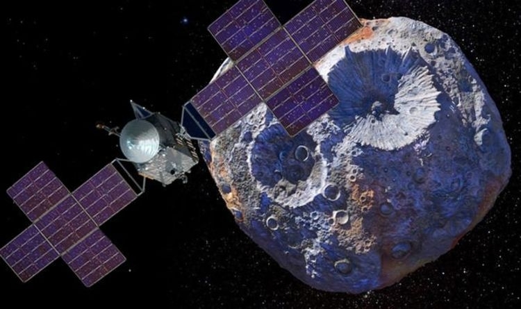A large satellite with solar panels floats in front of an asteroid in space