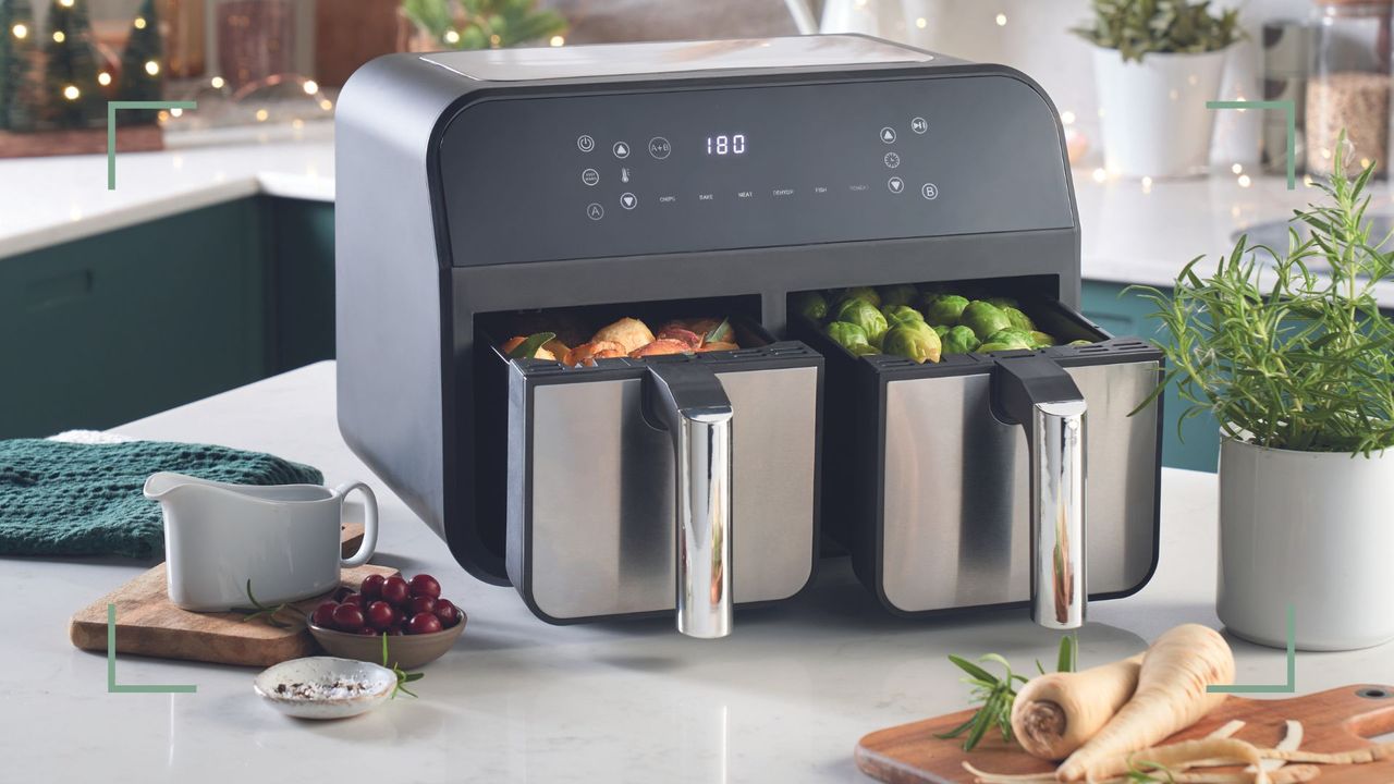 double basket Aldi air fryer on a kitchen countertop with vegetables being cooked