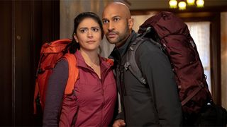 Cecily Strong and Keegan-Michael Key wearing backpacks in Apple TV Plus Original Schmigadoon!