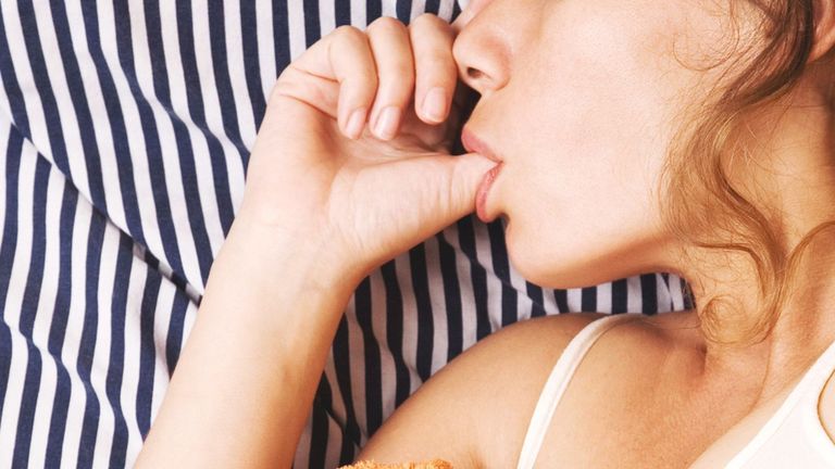 Someone sucking their thumb