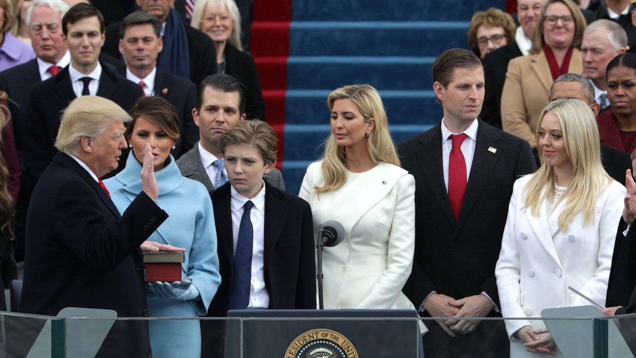 Donald Trump takes the oath of office from Supreme Court Chief Justice John Roberts.