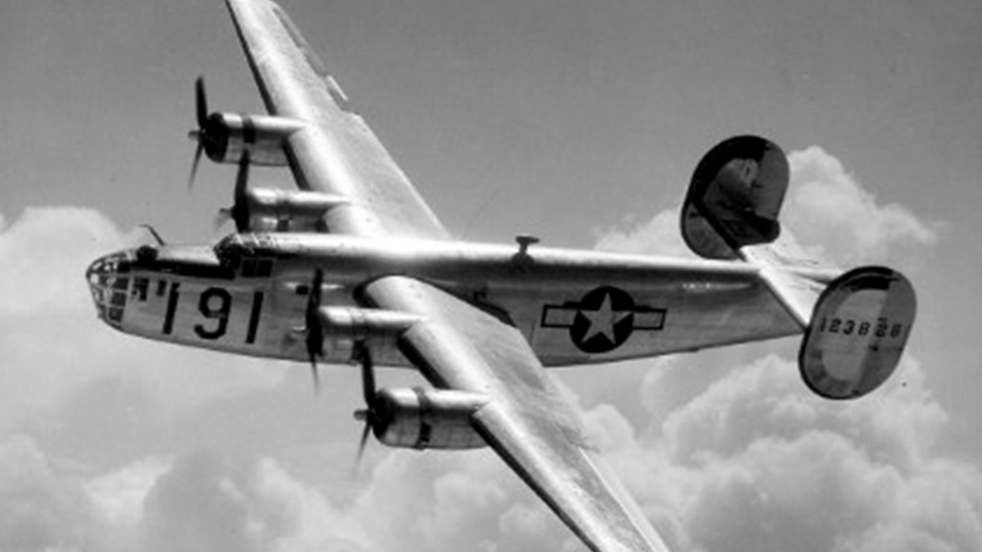 A black-and-white photo of a B-24 Liberator bomber used in World War II.