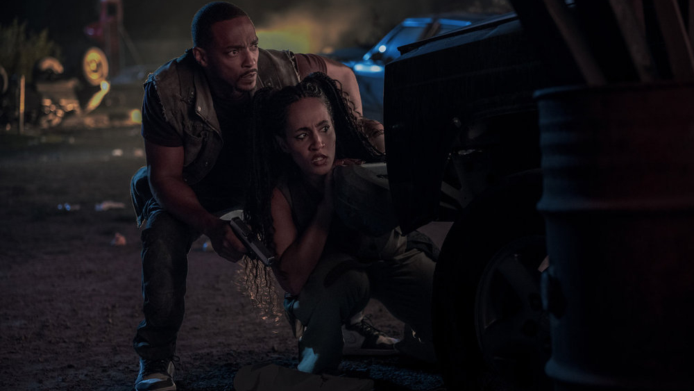 L-R: Anthony Mackie as John Doe, Tiana Okoye as Dollface in Peacock's "Twisted Metal" season 2