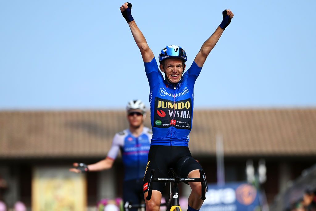 SANTUARIO DI CASTELMONTE ITALY MAY 27 Koen Bouwman of Netherlands and Team Jumbo Visma Team Blue Mountain Jersey celebrates at finish line as stage winner ahead of Mauro Schmid of Switzerland and Team QuickStep Alpha Vinyl during the 105th Giro dItalia 2022 Stage 19 a 178km stage from Marano Lagunare to Santuario di Castelmonte 577m Giro WorldTour on May 27 2022 in Santuario di Castelmonte Italy Photo by Tim de WaeleGetty Images