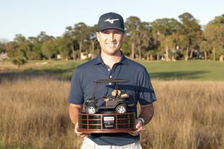 Steven Fisk holds the Club Car Championship trophy