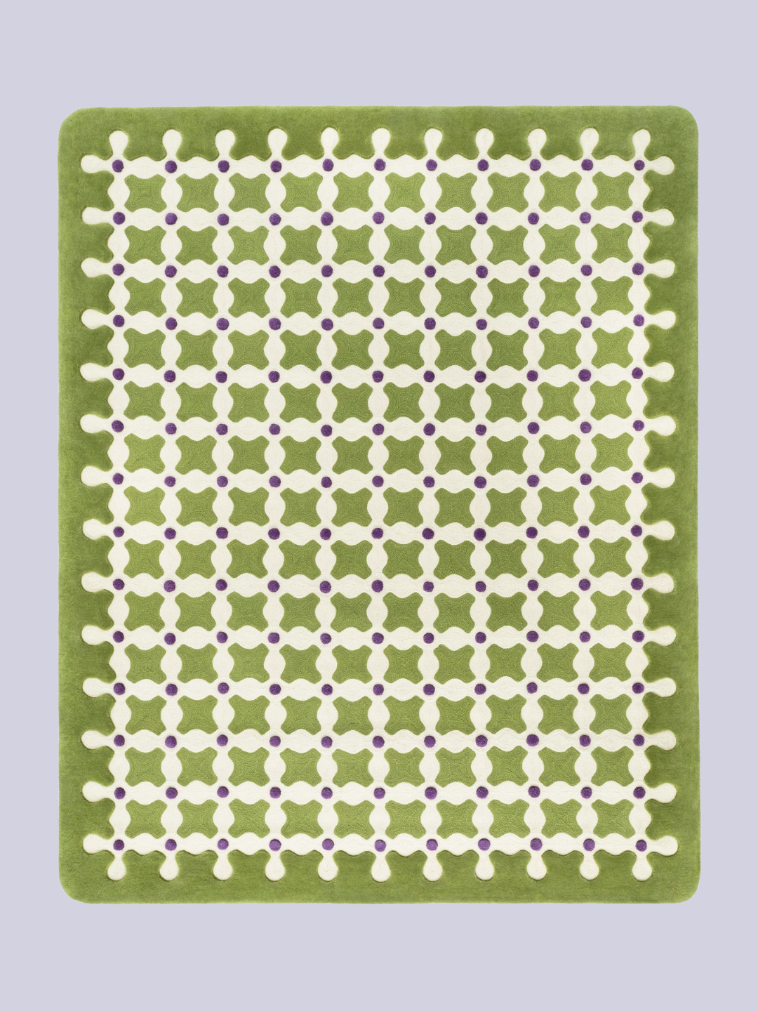 A green criss cross patterned rug from CC-Tapis by India Mahdavi