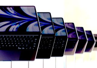 A line of MacBook Pros.