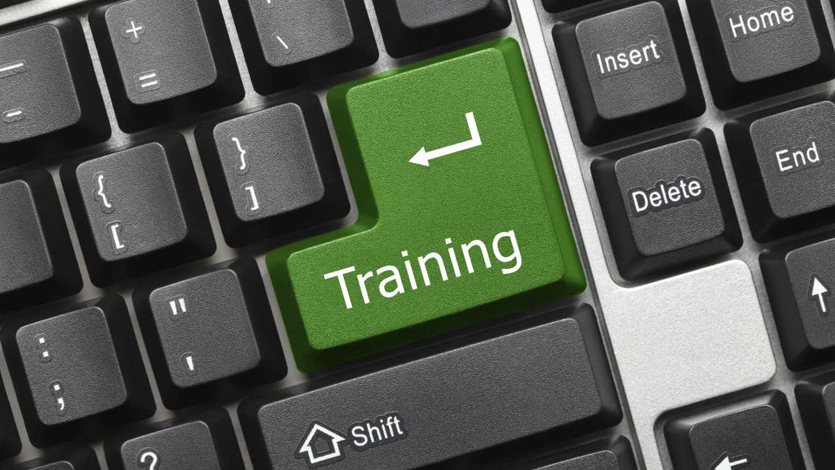 Closeup of keyboard with large green enter key &quot;Training&quot;