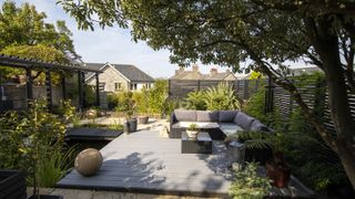grey garden decking with outdoor corner sofa