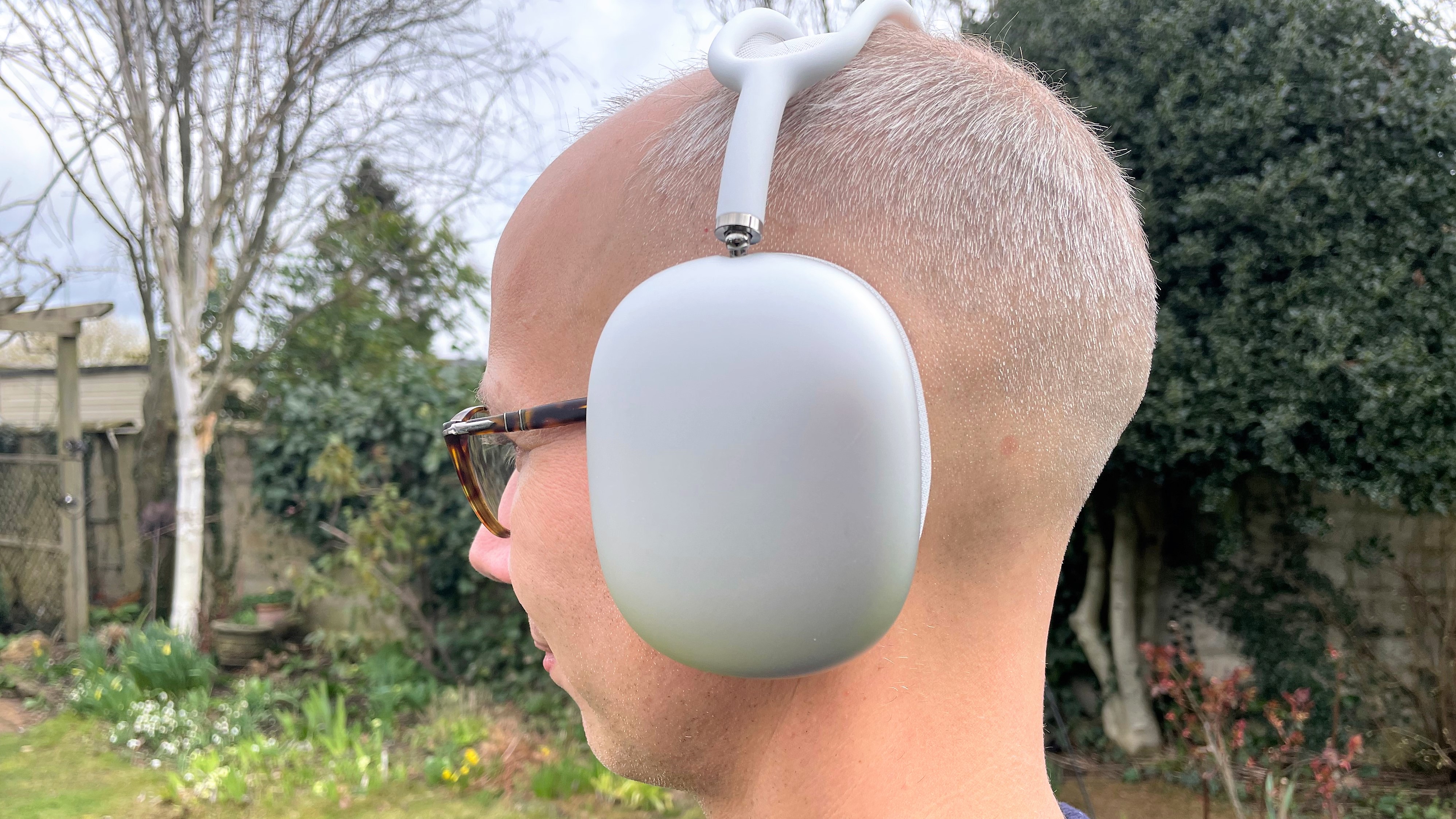 Apple AirPods Max worn by the reviewer in the park