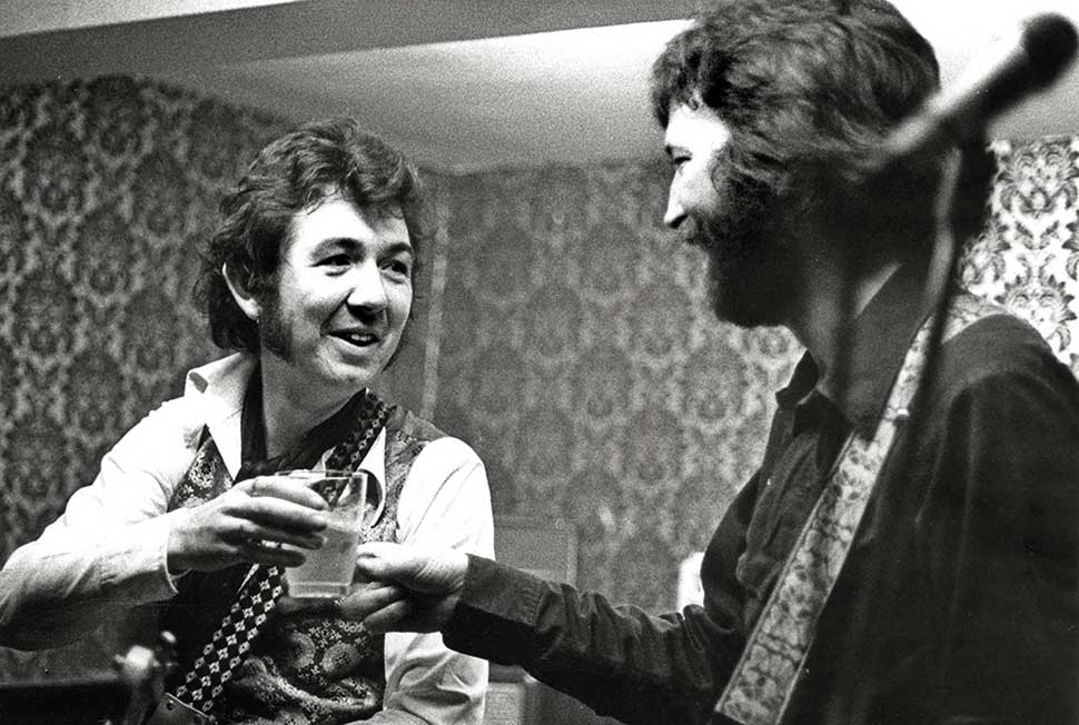 Ronnie Lane performing with Eric Clapton at the Drum and Monkey pub in Minsterley, Shropshire, 1977