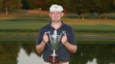 Harry Hall holds up the ISCO Championship trophy after winning in 2024