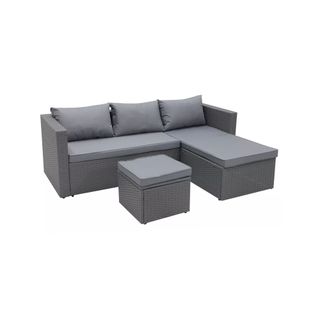 A dark grey PE-rattan outdoor corner sofa with padded footstool