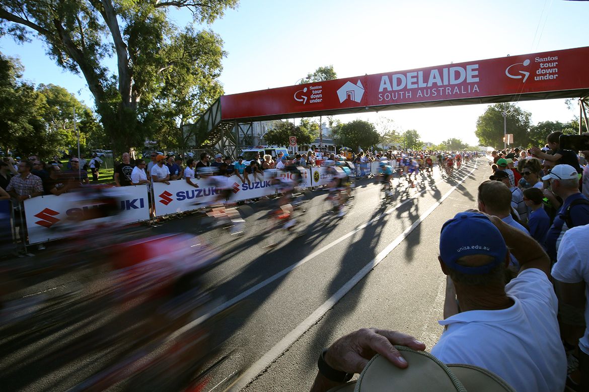 The peloton flies past