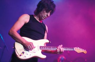 Jeff Beck plays slide in standard tuning and wears his slide on his second finger.