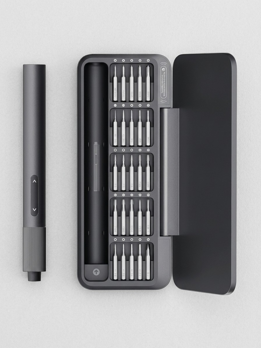 A Hoto electric screwdriver with a collection of bits and a carry case, on a grey background