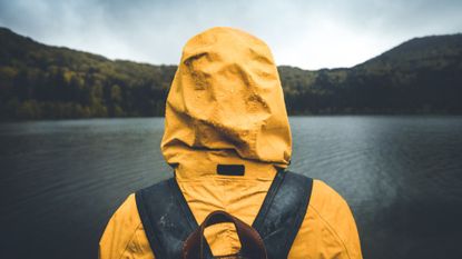 Hiking in the rain wearing a waterproof coat