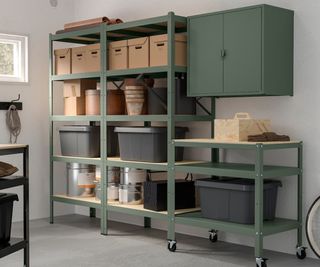 green metal storage shelves with small trolley on wheels