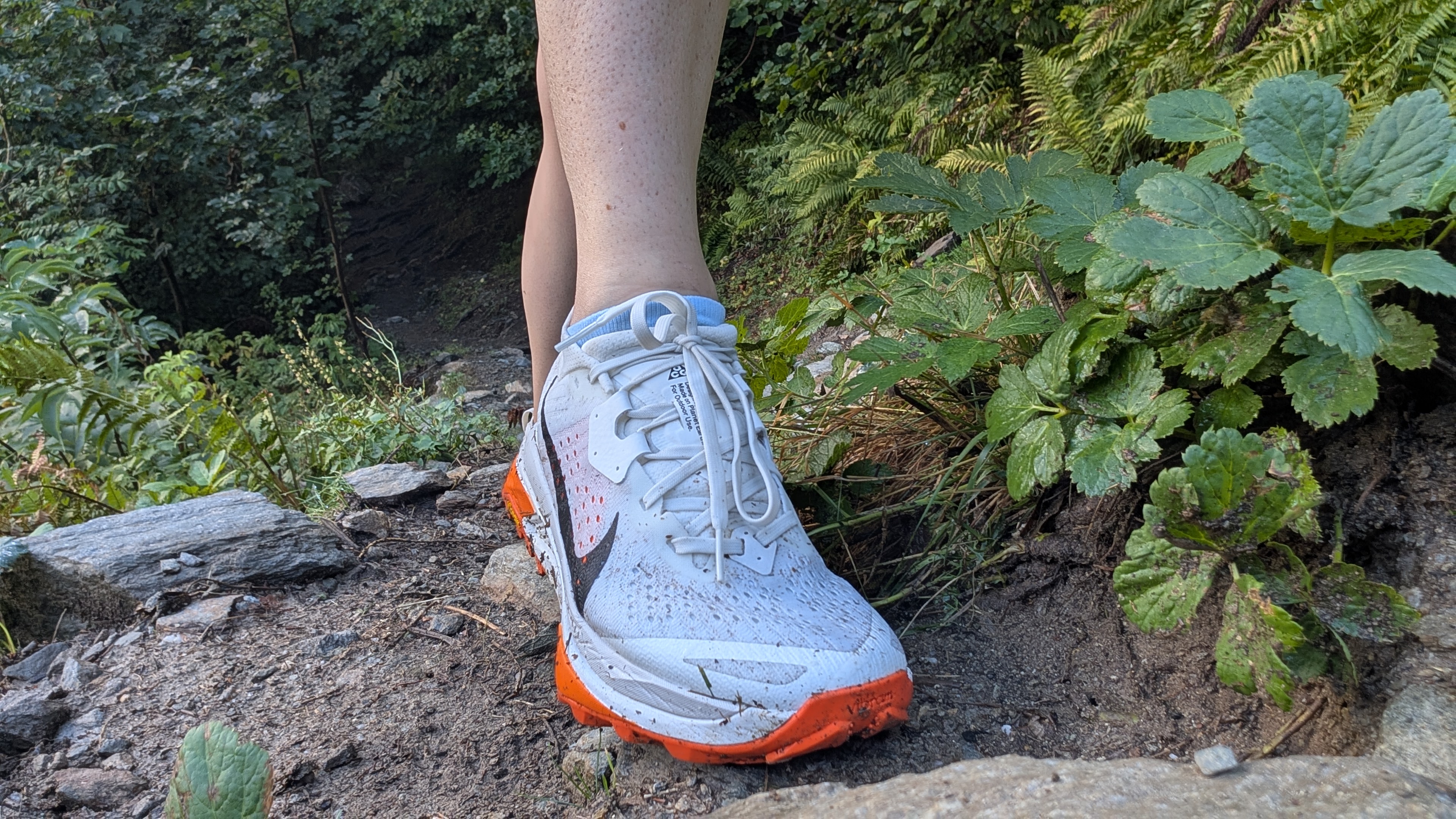 Runner's feet wearing the Nike ACG Zegama Trail shoes on a trail