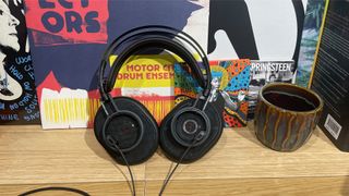 Austrian Audio The Composer open-back headphones leant at angle on wooden shelf
