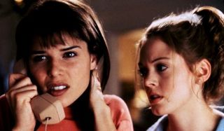Scream Neve Campbell listening intent on the phone