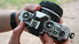 An aerial view of the Nikon Z fc being held in someone's hands