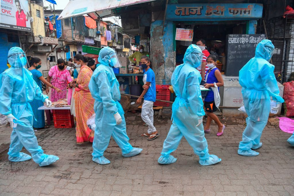 Door-to-door medical screening inside a Mumbai slum.