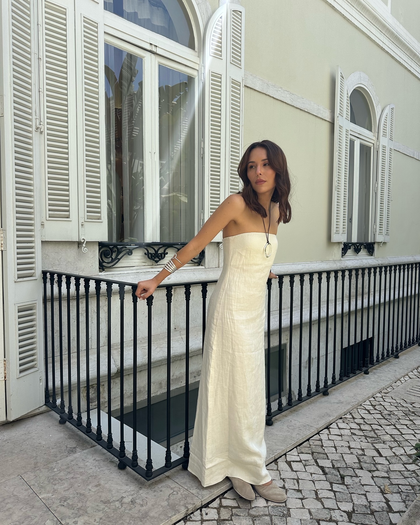 Woman wearing linen maxi dress.