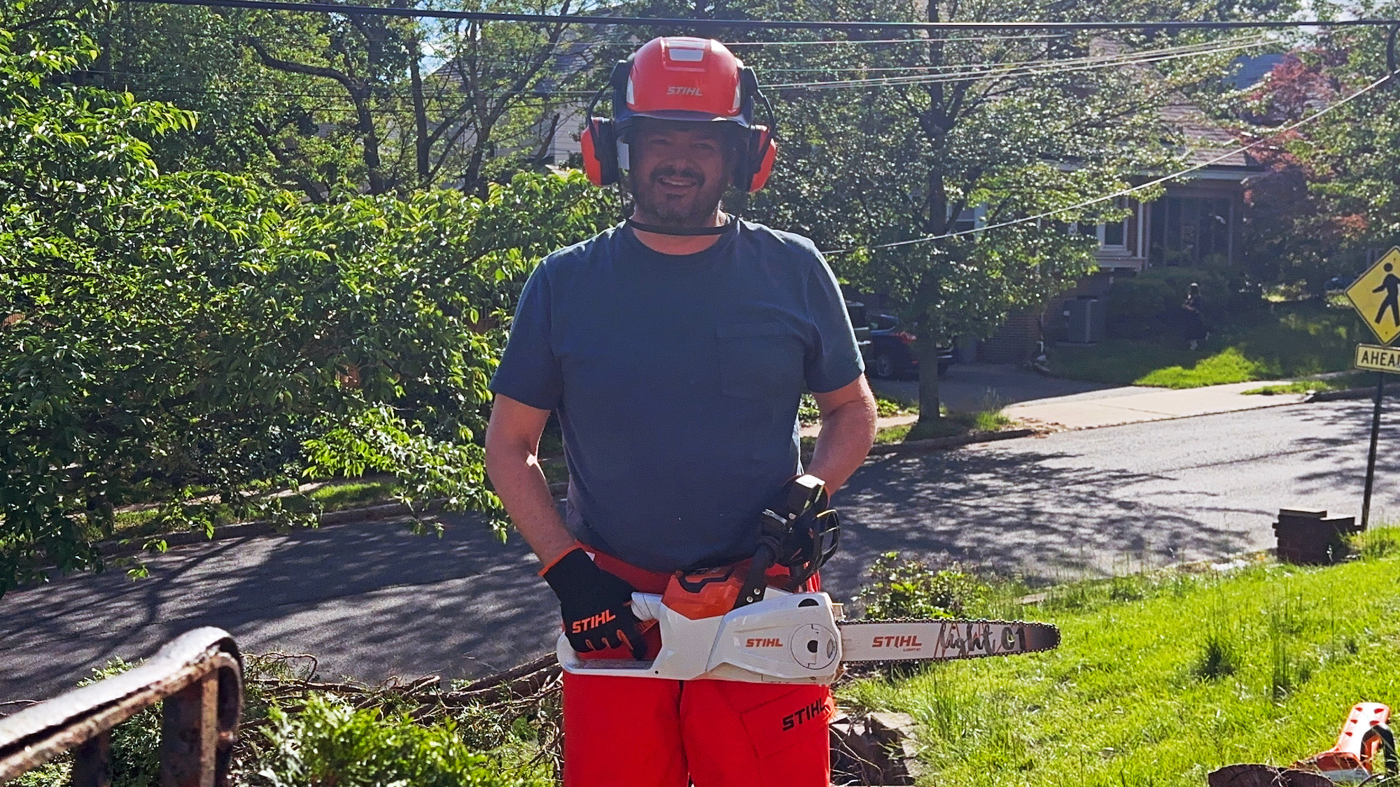 man holding Stihl chainsaw