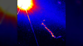 An fire hot ball appears in an image of a quasar taken by the Hubble Space Telescope.