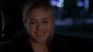 Cher smiling in the car in Clueless