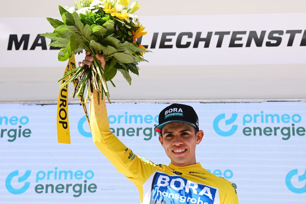 MALBUM SWITZERLAND JUNE 18 Sergio Andres Higuita Garcia of Colombia and Team Bora Hansgrohe celebrates winning the yellow leader jersey on the podium ceremony after the 85th Tour de Suisse 2022 Stage 7 a 1946km stage from Ambri to Malbun 1560m tourdesuisse2022 WorldTour on June 18 2022 in Malbun Switzerland Photo by Tim de WaeleGetty Images