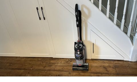 hoover hl5 upright vacuum cleaner stood next to stair case