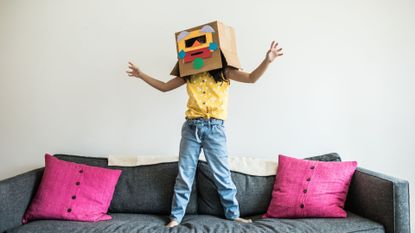 Easy Crafts for kids illustrated by kid with cardboard robot head