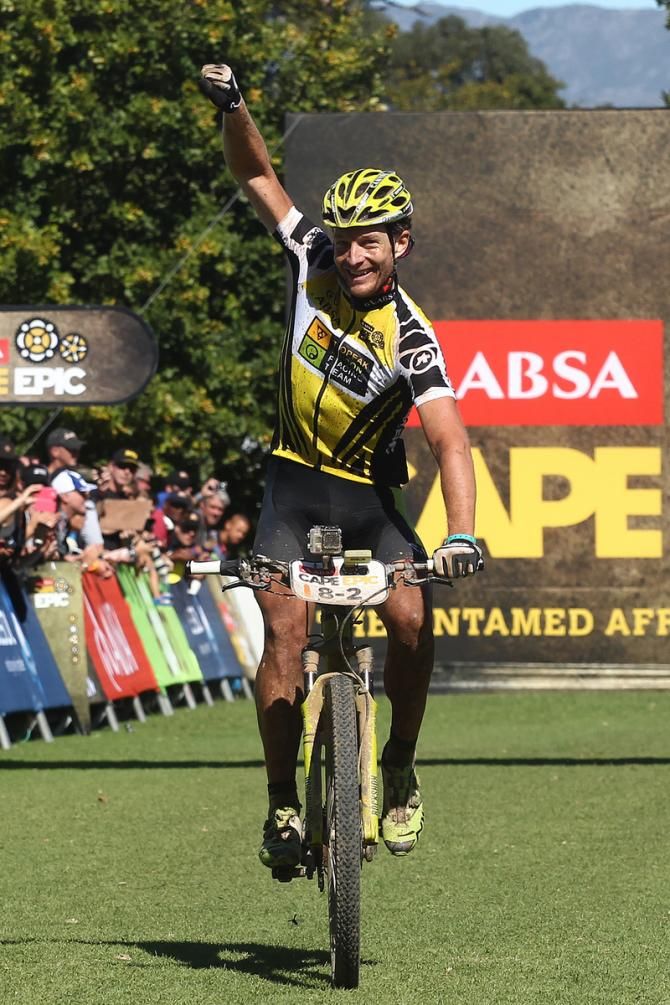 Race Leaders Kristian Hynek and Robert Mennen (unsighted) of Topeak-Ergon Racing celebrate as they finish second and retain the overall leaders yellow jersey going into the final stage